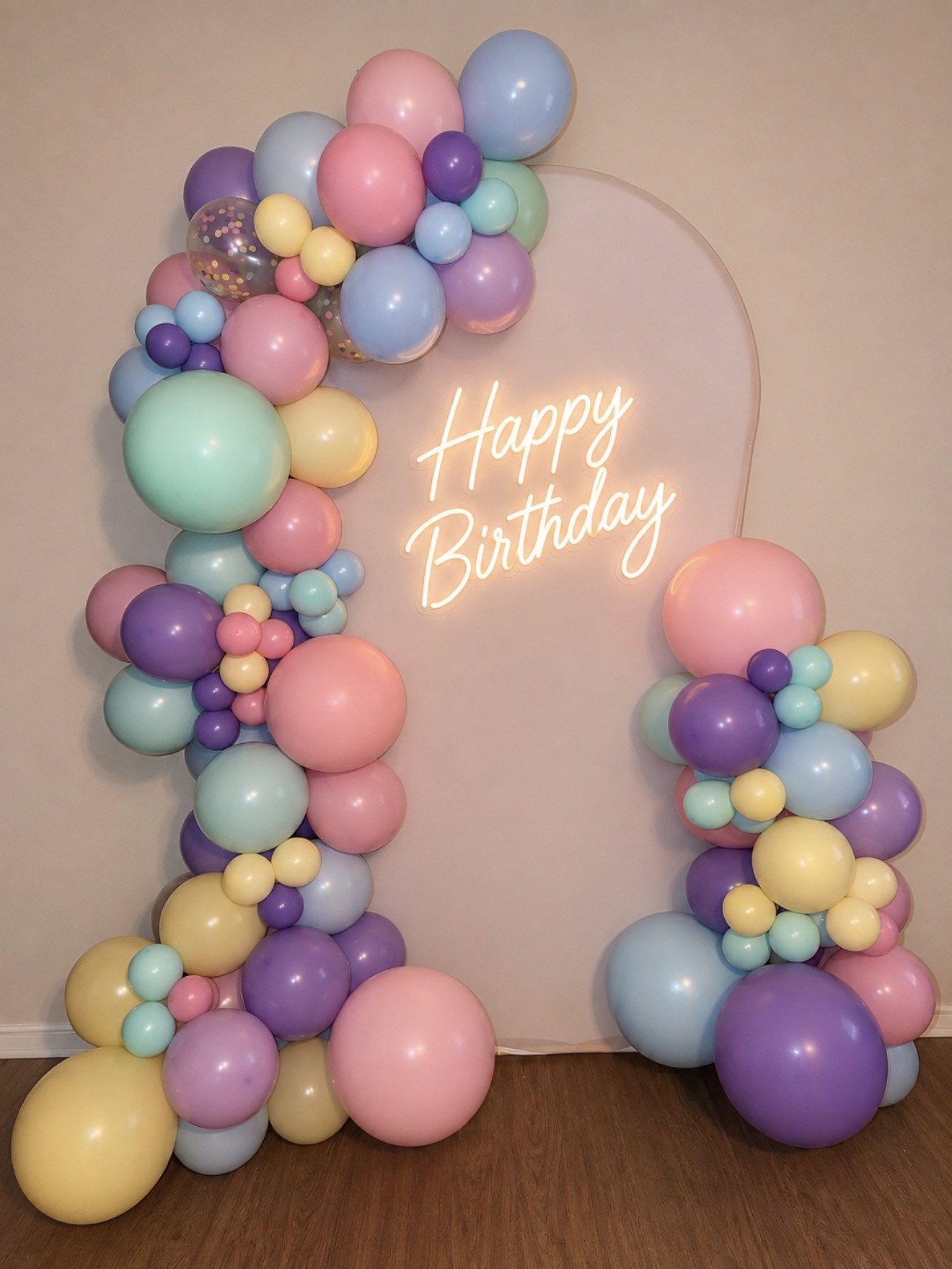 Pastel balloon arch for a birthday celebration