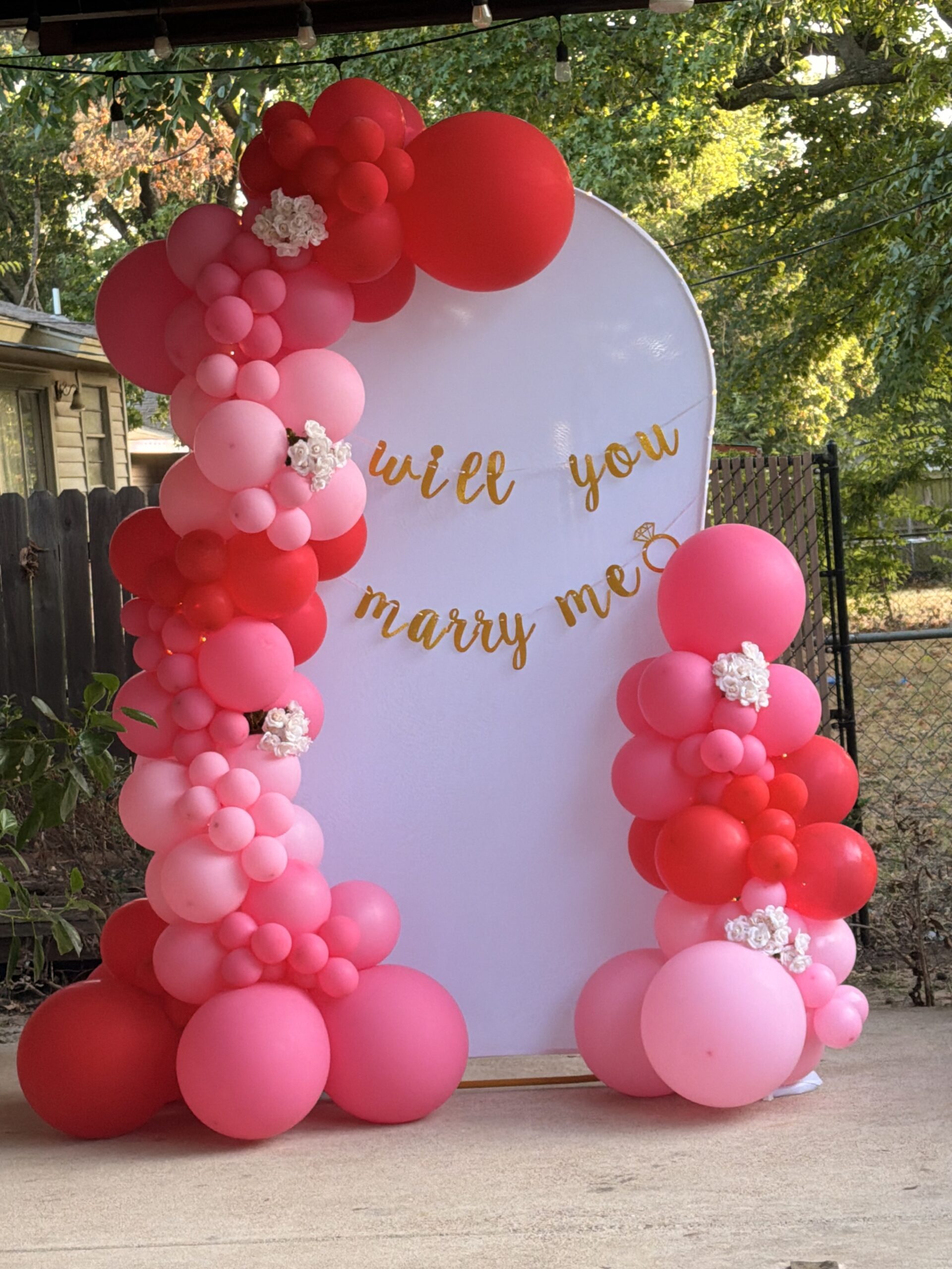 Pink balloon arch and backdrop